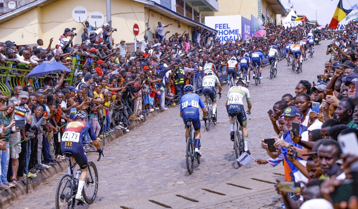 Riders climb  the Mur de Kigali, the legendary cobblestone climb on Sunday, September 28. Photo by Dan Gatsinzi