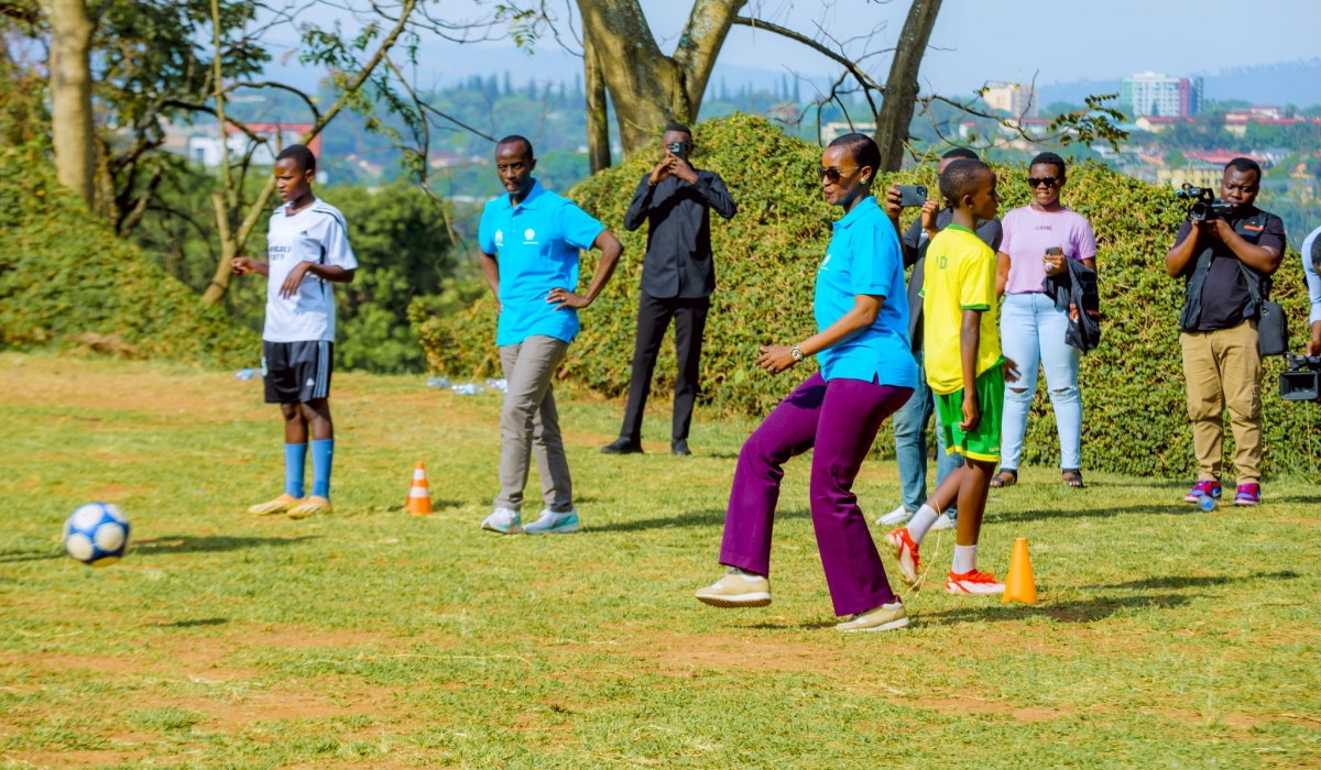 Minister of Sports Nelly Mukazayire plays with students at Lycee de Kigali during the official launch of Inter-Schools competitions-courtesy photos