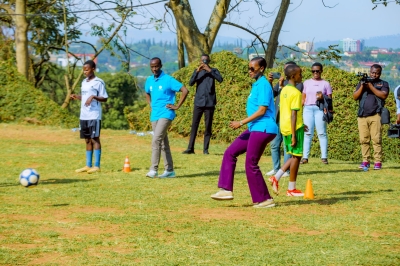 Minister of Sports Nelly Mukazayire plays with students at Lycee de Kigali during the official launch of Inter-Schools competitions-courtesy photos