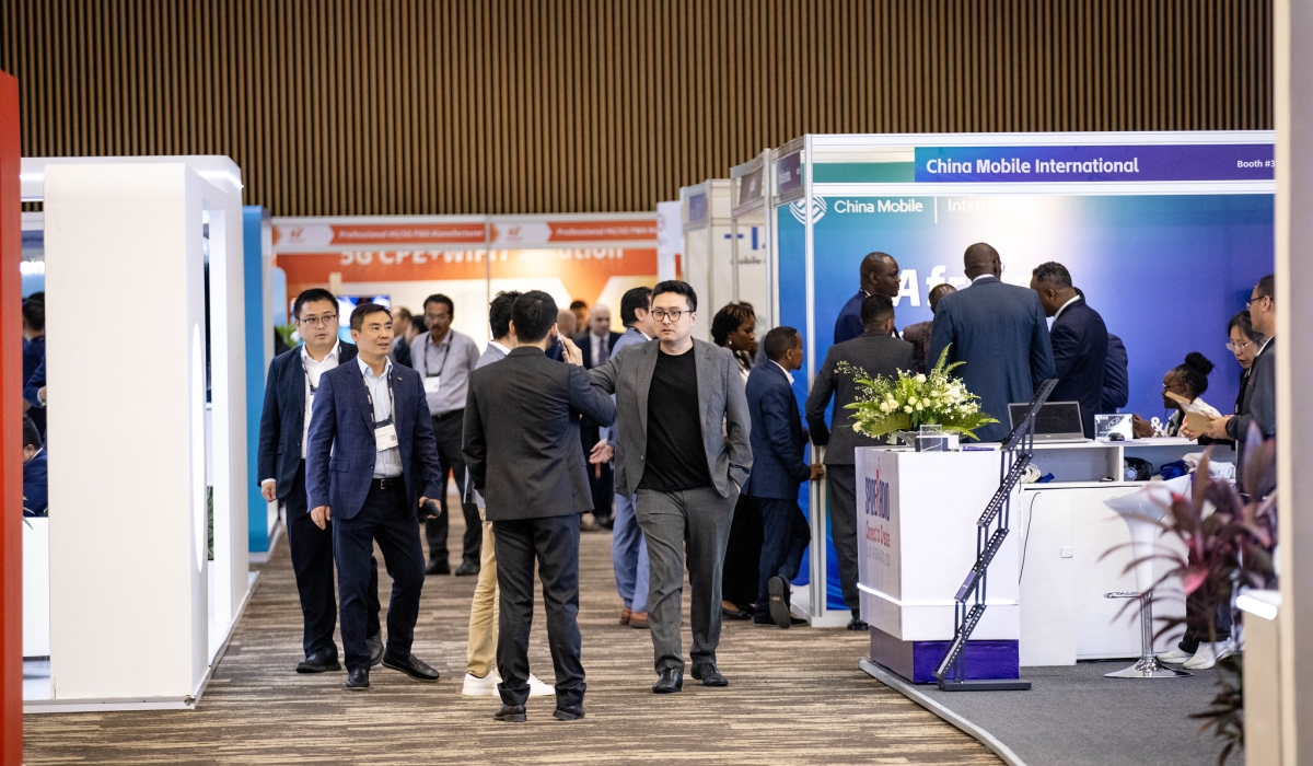 Delegates tour an exhibition area at the third Mobile World Congress (MWC) Africa, a three-day conference that opened in Kigali on October 21. Photo by Dan Gatsinzi