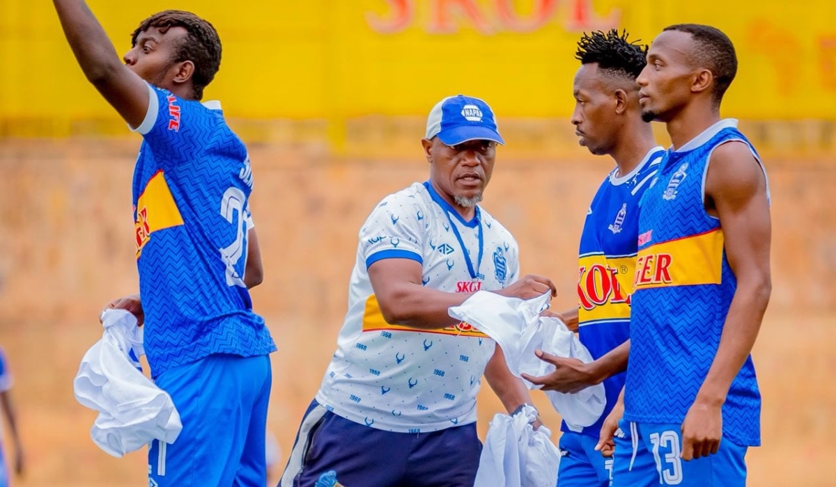 Rayon Sports interim coach Haruna Ferouz gives instructions to players during a training session at Nzove stadium. Courtesy