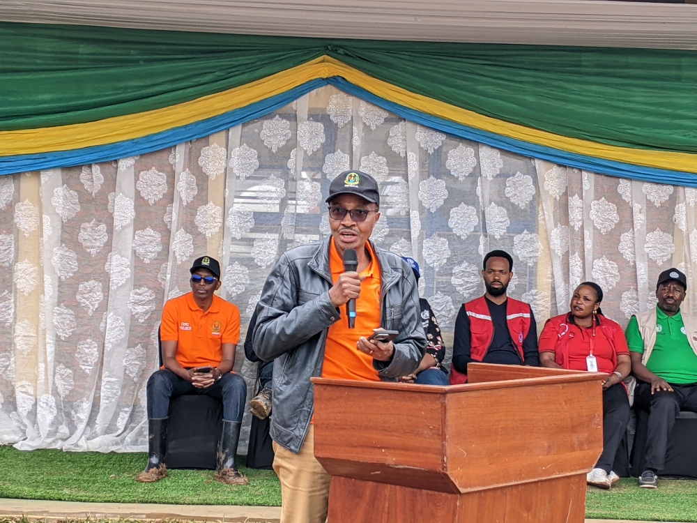 The Minister in charge of Emergency Management, Maj Gen (Rtd) Albert Murasira, joins Kivumu residents in a community work on Saturday,  October 25. Photo: Germain Nsanzimana