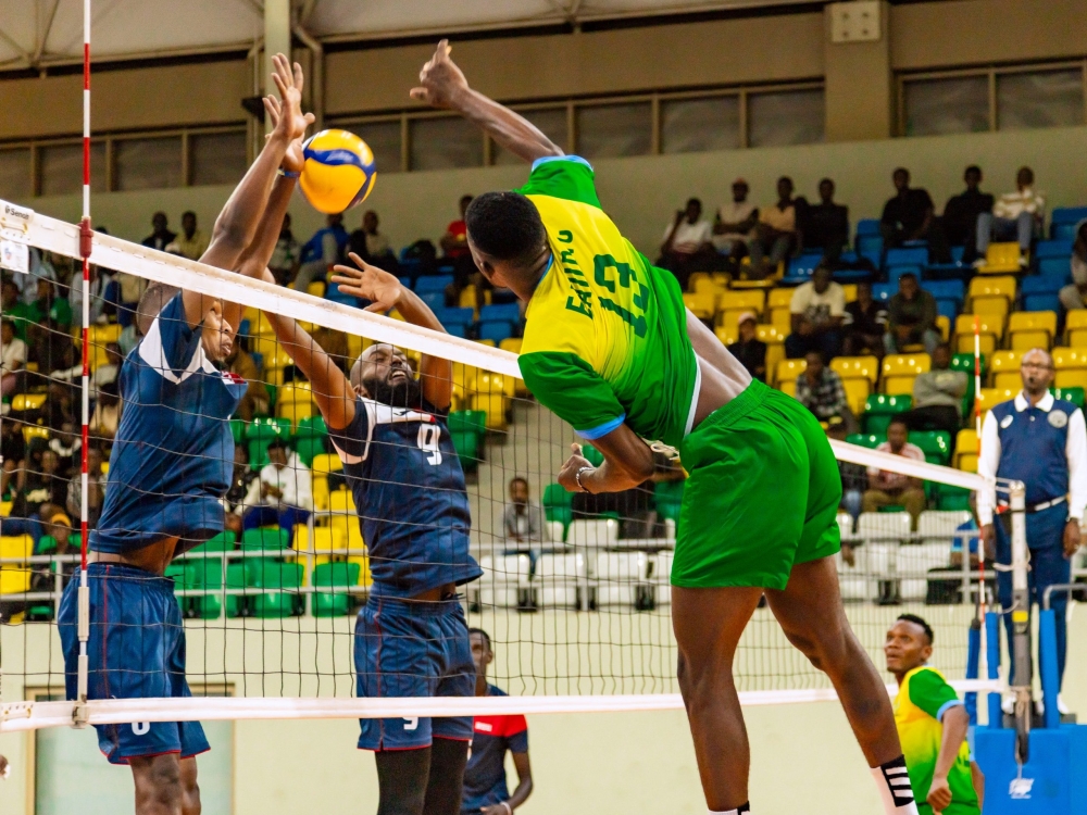 Rwanda Energy Group Volleyball Club players try a block, during the game. Courtesy