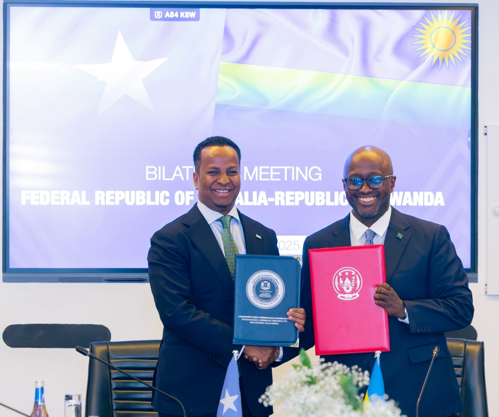 The Minister of Foreign Affairs and International Cooperation, Olivier Nduhungirehe, and his Somali counterpart, Abdisalam Abdi Ali during the signing ceremony in Kigali on Monday, October 27. Courtesy