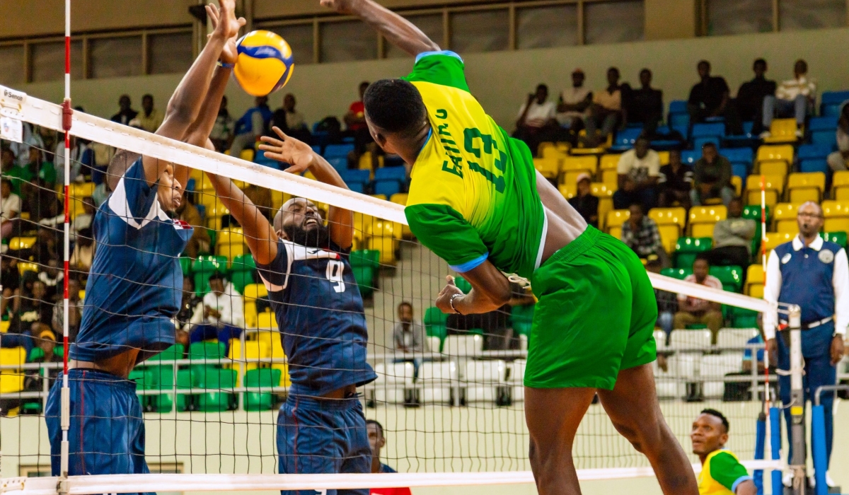 Rwanda Energy Group Volleyball Club players try a block, during the game. Courtesy