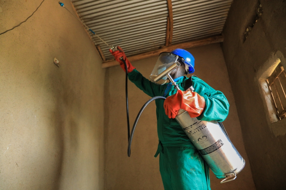 A worker conducts a spraying exercise a house in Bugesera. RBC has started spraying homes in 28 sectors most affected by the disease, including areas in Gisagara, Bugesera, Nyagatare, Rwamagana, and 