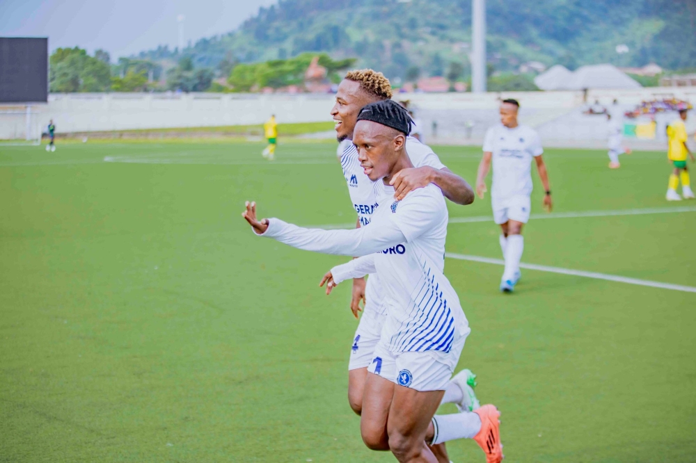 Police FC striker Lague Byiringiro (right) celebrates with his teammate Alain Bacca  Kwitonda, during a 2-1 game against Marine FC at Umuganda Stadium. Courtesy