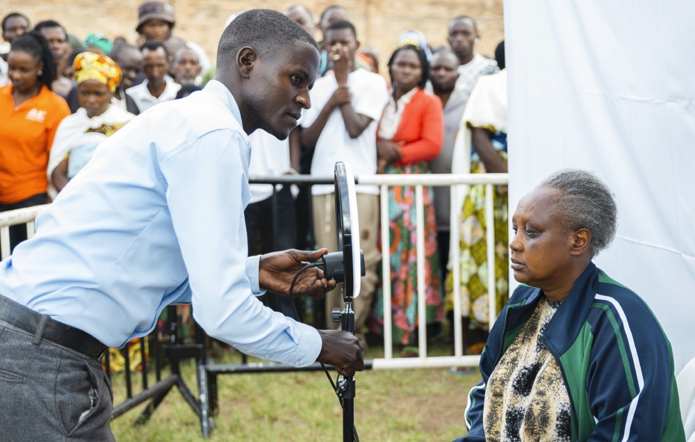 NIDA staff takes pictures of residents during the launch of the nationwide identity verification and photo registration exercise for Single Digital ID on Tuesday,  October 28. Courtesy