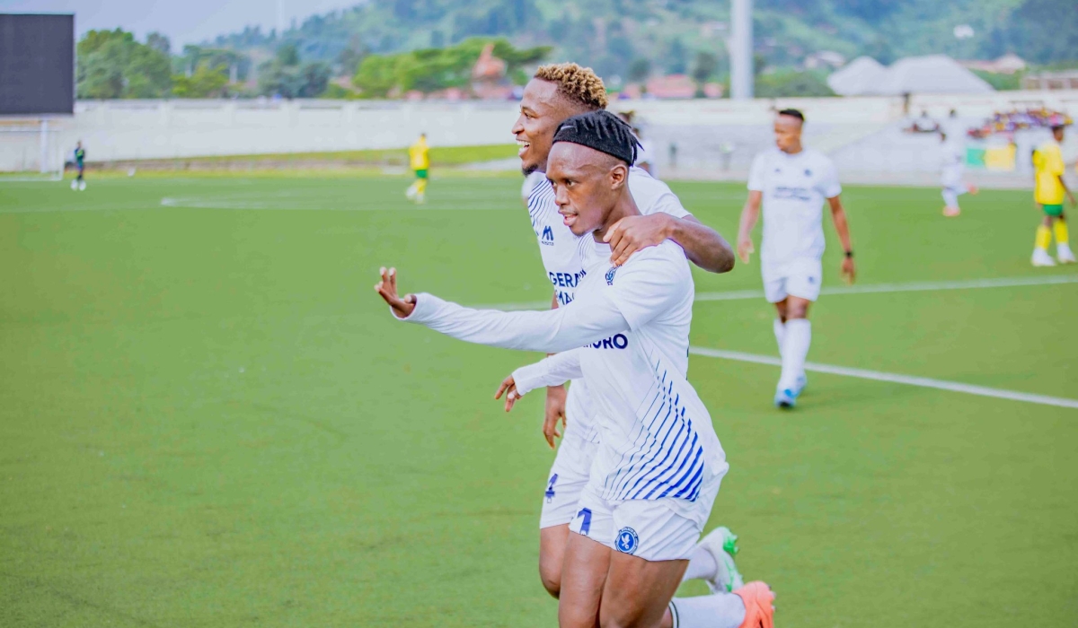Police FC striker Lague Byiringiro (right) celebrates with his teammate Alain Bacca  Kwitonda, during a 2-1 game against Marine FC at Umuganda Stadium. Courtesy