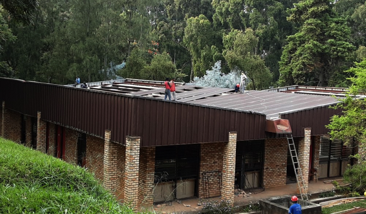 Workers remove asbestos on the roof of one of buildings of University of Rwanda in Huye. File