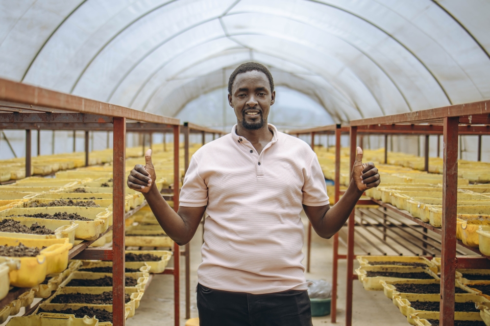 Francis Kavutse, CEO of Maggot Farm, celebrating the greenhouse constructed and equipped with support from CASA.