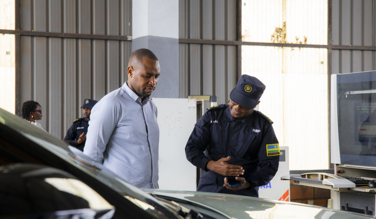 Minister of State for Infrastructure, Jean de Dieu Uwihanganye, observes a gas emission testing demonstration at the Remera Automobile Inspection Centre on Friday, November 1. Courtesy. 