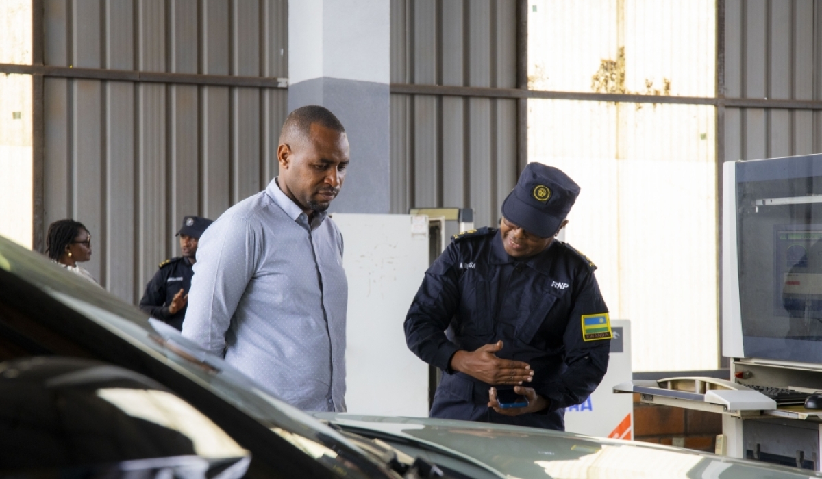 Minister of State for Infrastructure, Jean de Dieu Uwihanganye, observes a gas emission testing demonstration at the Remera Automobile Inspection Centre on Friday, November 1. Courtesy.
