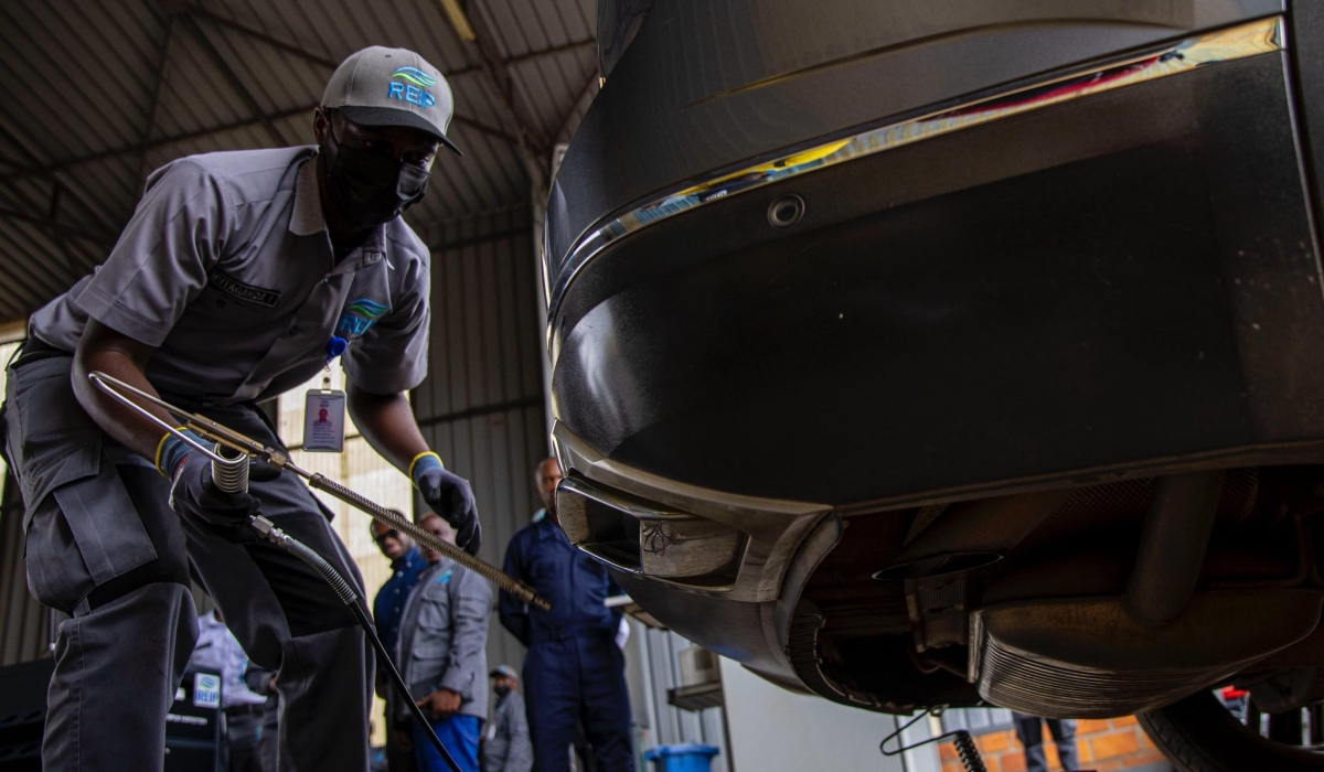 A mechanic inspects a vehicle in Kigali for mechanical and emissions compliance, supporting ongoing efforts to improve air quality and environmental health. Courtesy Photo
