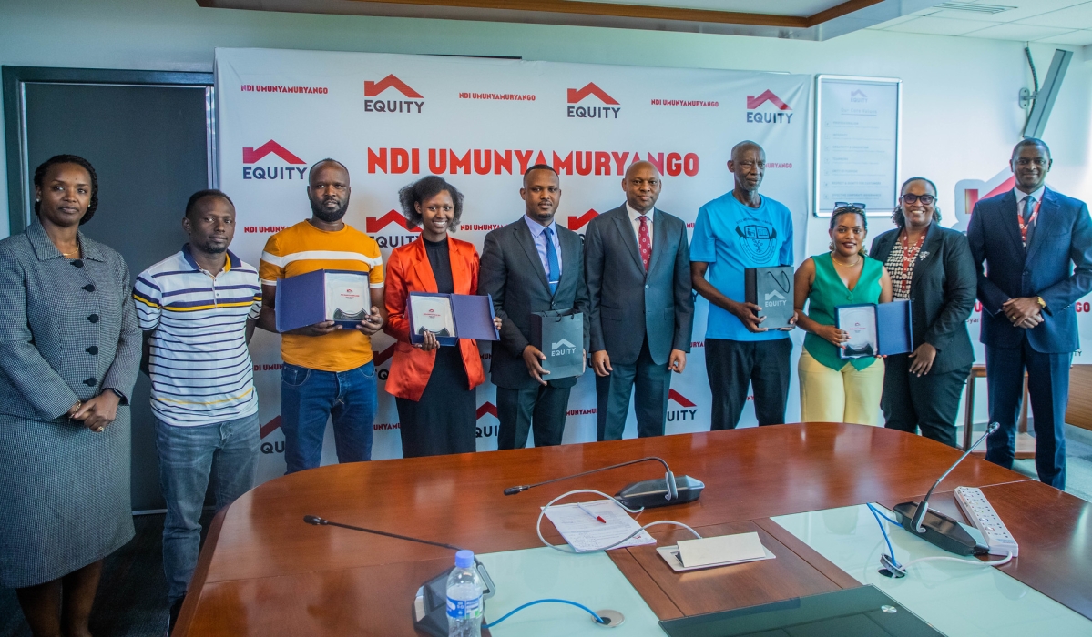 Equity Bank officials and clients pose for a group photo during the launch of the new Ndi Umunyamuryango campaign in Kigali on November 4. Photos by Craish Bahizi