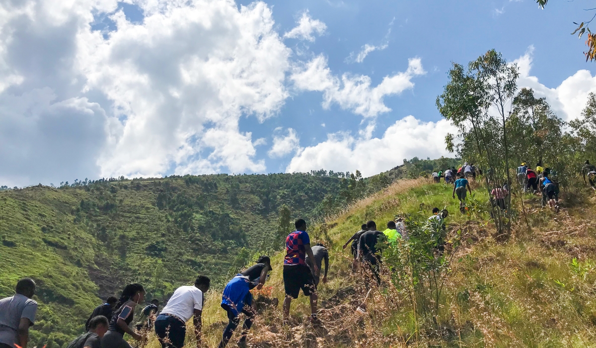 A group of Kigali residents hikes a mountain in Rulindo District. Photo by Olivier Mugwiza