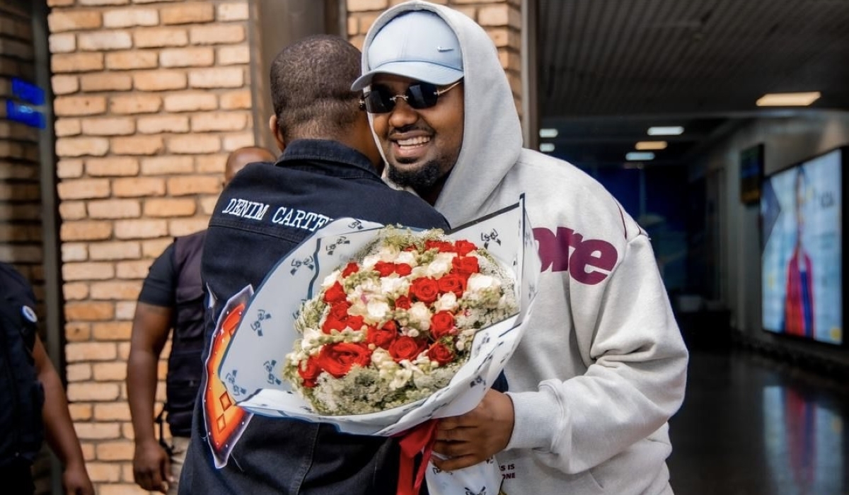 Rwandan musician Kitoko Bibarwa was welcomed by members of the media and Bruce Intore, the CEO of Intore Entertainment which invited him to perform at Davido's concert in Kigali-Photo by Inyarwanda 