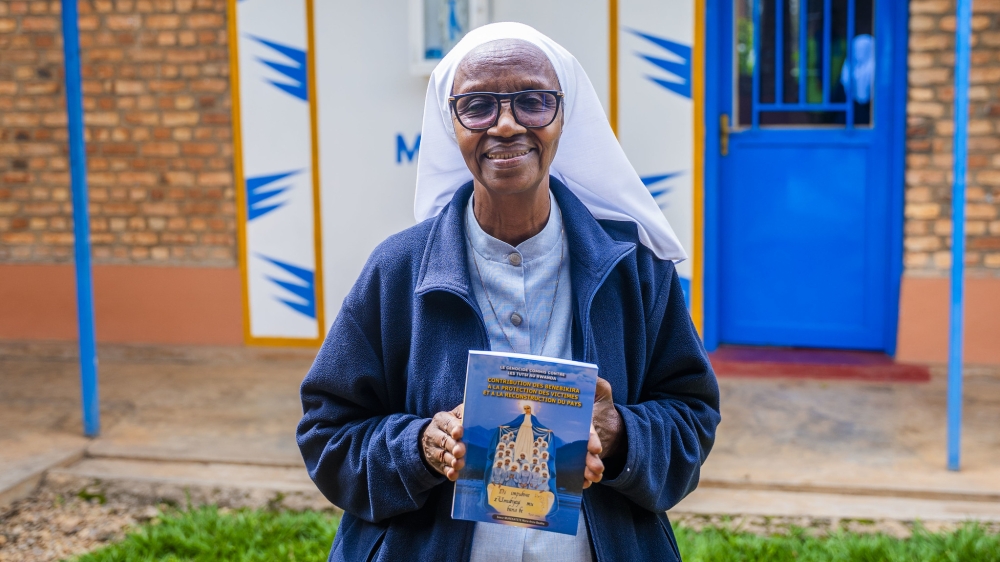 Sister Anna Beata Murekatete, poses for a photo holding her newly published book on the  November 7, 2025. Photos by Kellya Keza