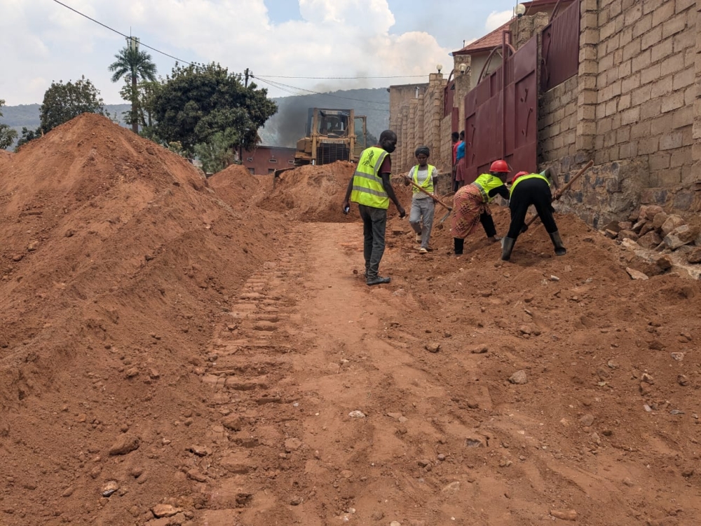 Workers on duty during the construction works to upgrade of the road that started in Jali Sector