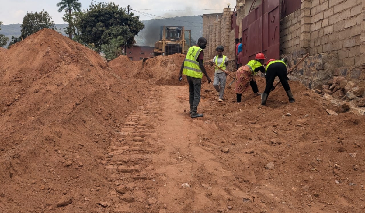 Workers on duty during the construction works to upgrade of the road that started in Jali Sector