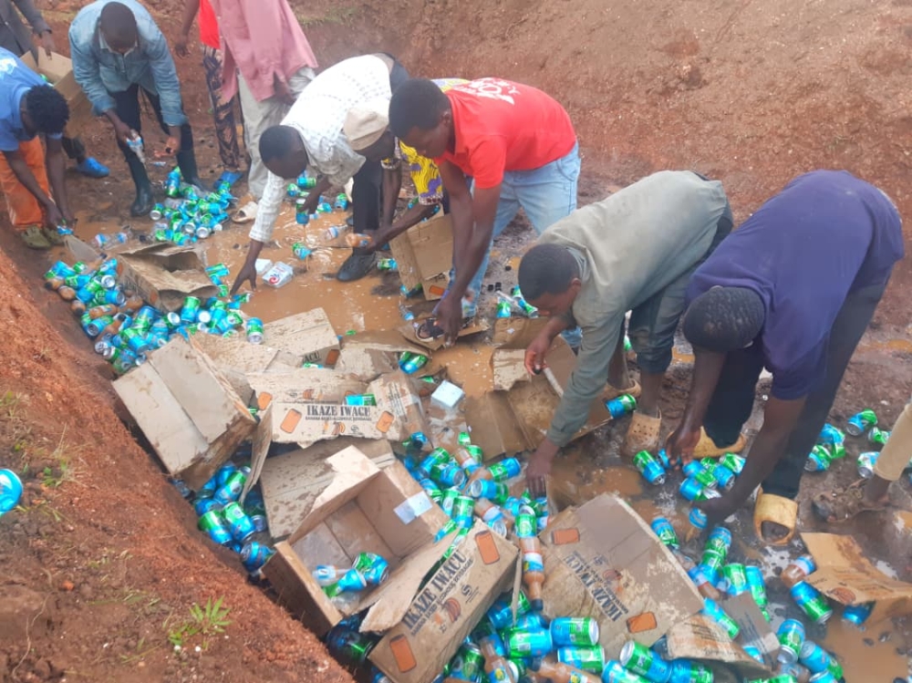 Residents destroy illicit beverages produced by Agahebuzo Drinks Processing Ltd in Nsinda Cell, Rwamagana District. Courtesy.