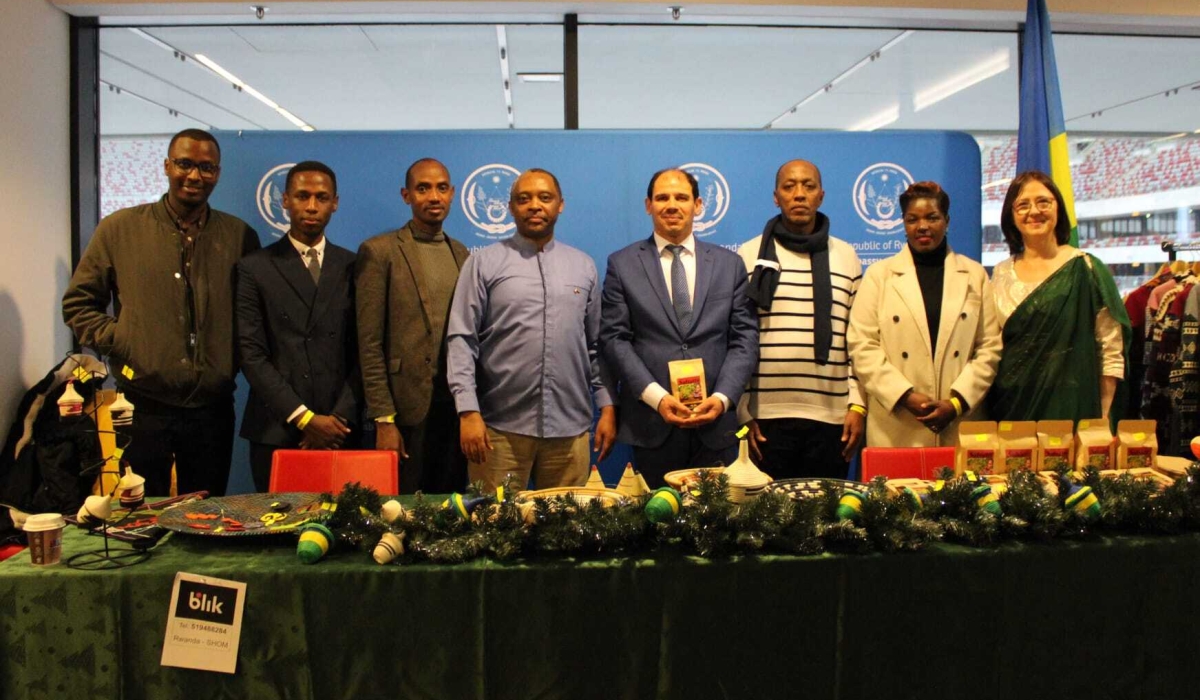 Amb Anastase Shyaka (4th left) and Rwandans who live in Poland pose for a photo. Green Hills Academy will host the first-ever Rwanda Diplomatic Charity Bazaar (RDCB), on November 22. Courtesy.