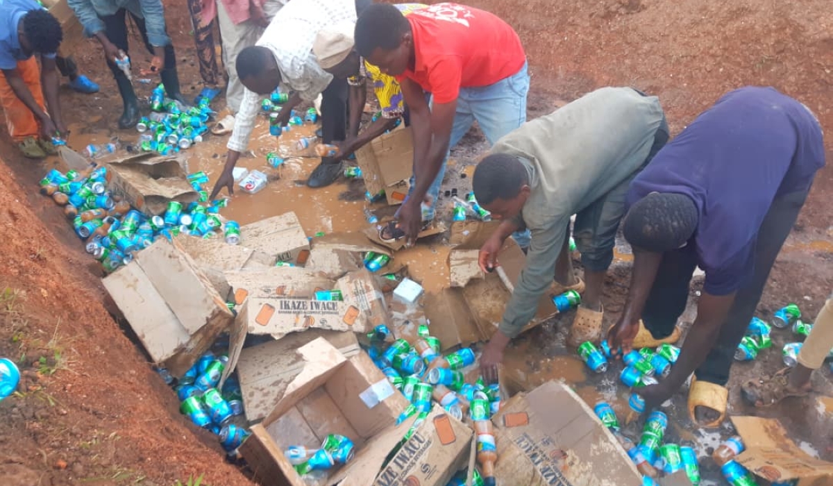 Residents destroy illicit beverages produced by Agahebuzo Drinks Processing Ltd in Nsinda Cell, Rwamagana District. Courtesy.