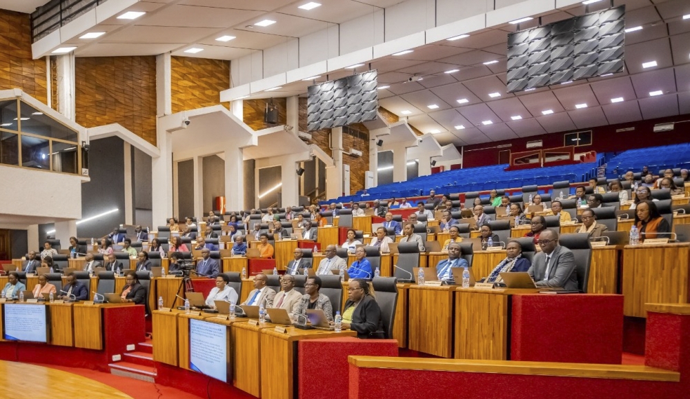 MPs follow Barnabé Sebagabo Muhire, Acting Chairperson of the the National Public Service Commission, as he addresses  a joint session of parliament on November 12. Courtesy