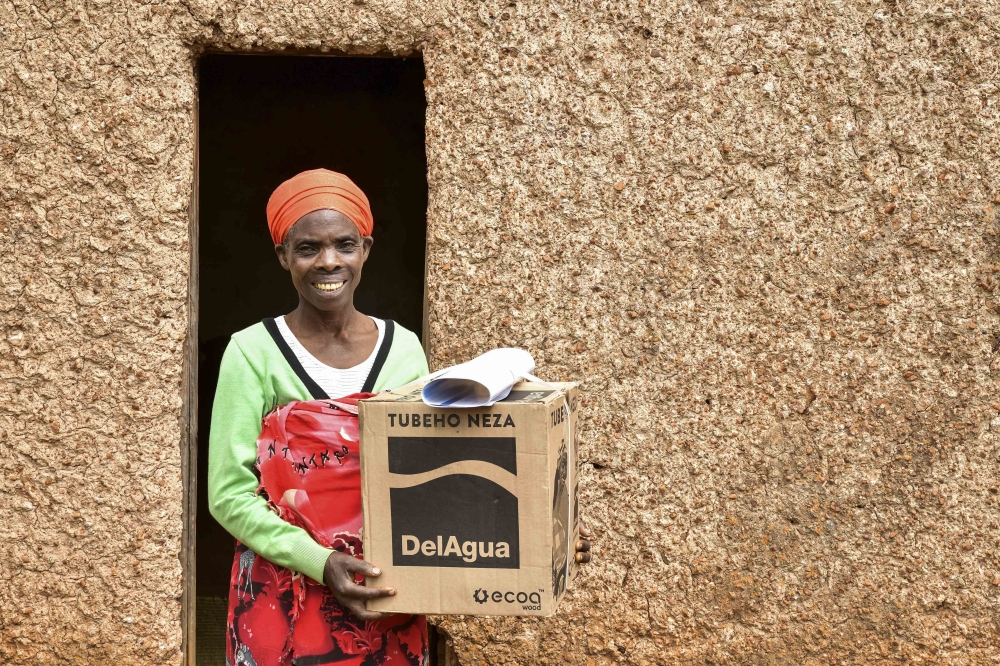 A beneficiary of the this clean cooking initiative after receiving stove. BPR Bank Rwanda Plc has concluded a financing facility to DelAgua Health Rwanda to support the financing of a landmark clean cooking initiative.