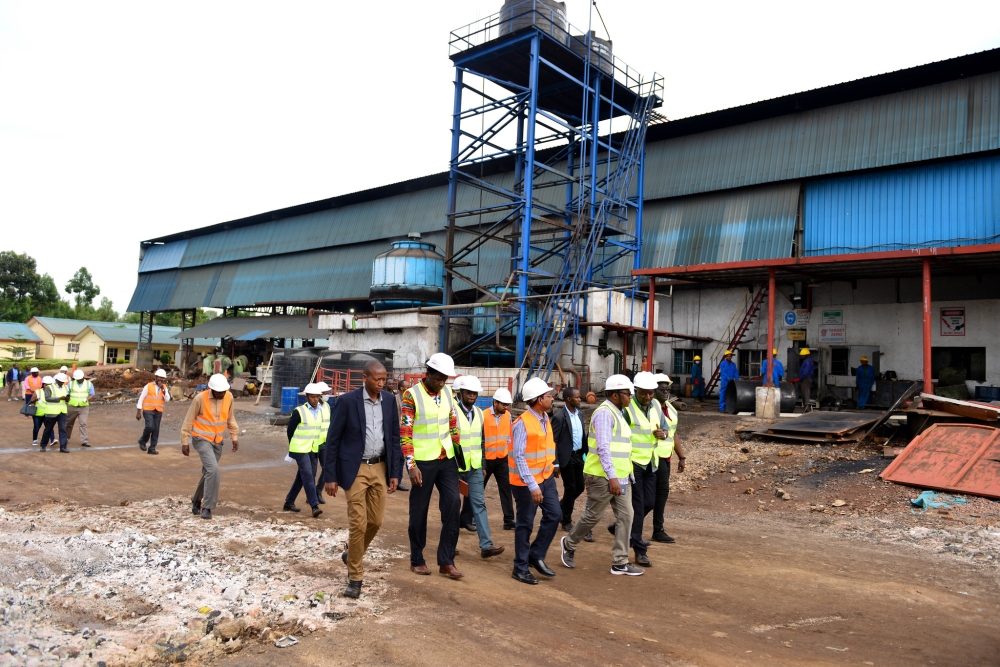 Officials during a guided tour  of  SteelRwa plant. At least 270 households living around SteelRwa plant in Rwamagana District, will be relocated  following air pollution concerns.