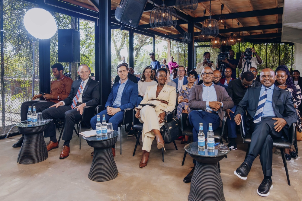 Delegates follow a presentation at the launch