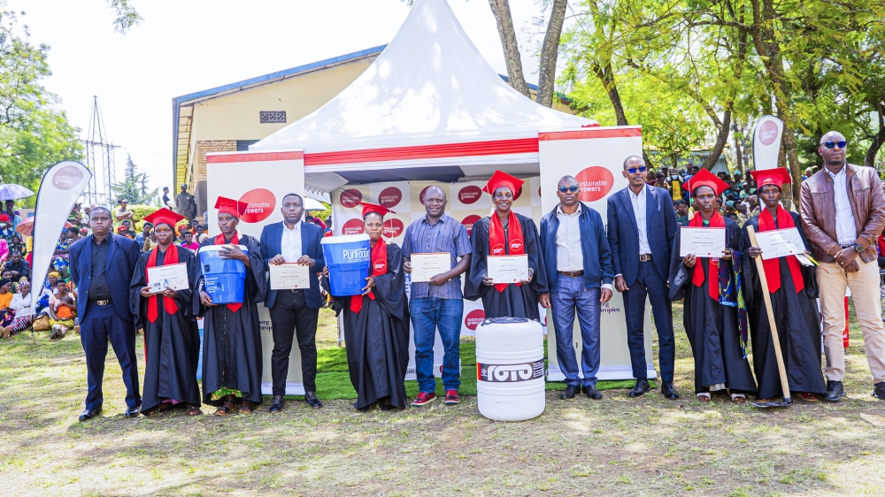 Officials and graduates pose for a group photo during the event in Gakenke on Wednesday, November 19. Photo by Kellya Keza