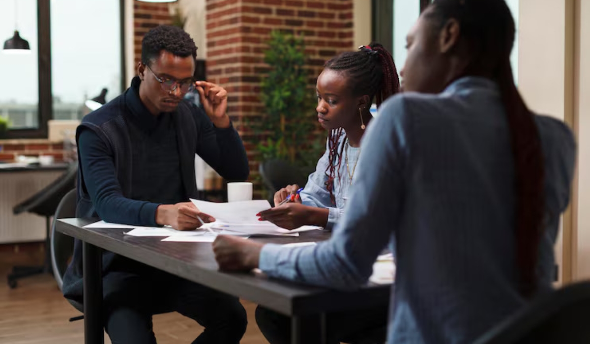 Workers during a consultative meeting in the office. Courtesy