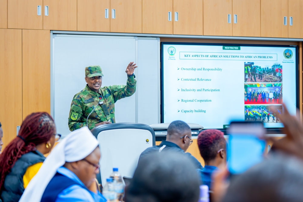  Rwanda Defence Force  Spokesperson, Brigadier General Ronald Rwivanga, gives a lecture to a visiting group of students and faculty officials from the University of Zambia in Rwanda on November 20. Courtesy