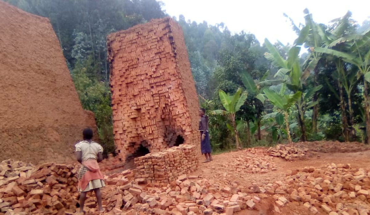 Children work at a brick collection point in Rubavu District. File
