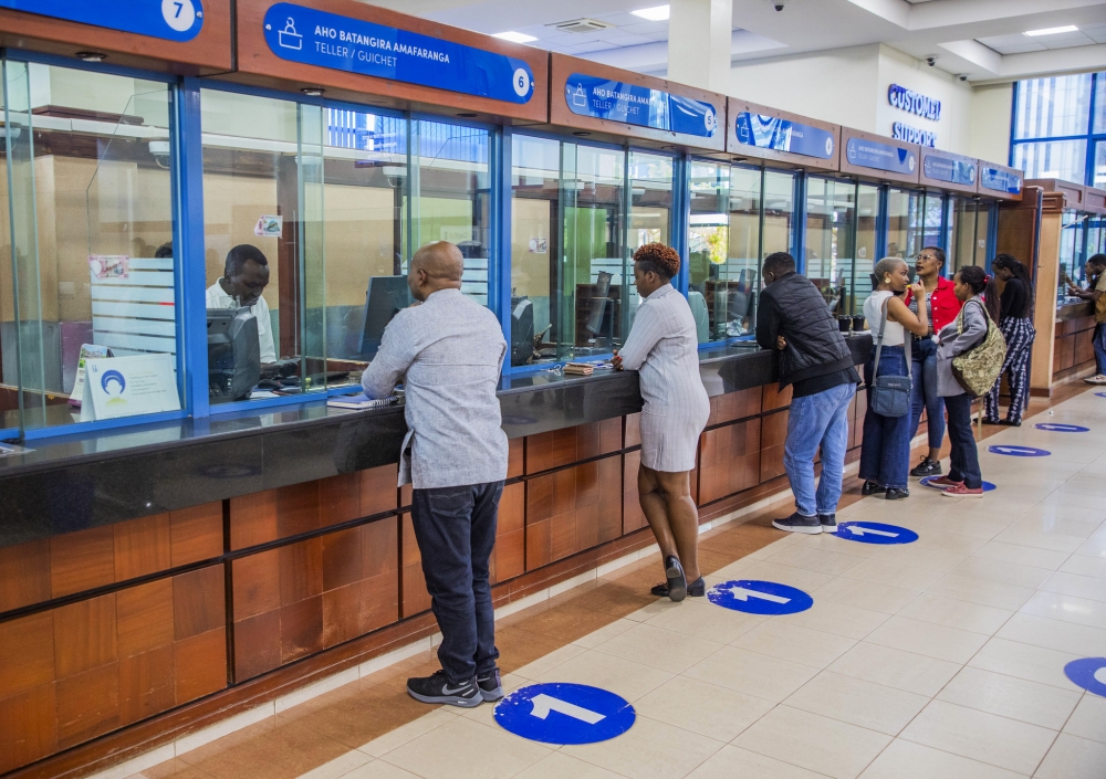 Bank tellers attend to the customers at Bank of Kigali main branch on October 10. Photo by Craish BAHIZI