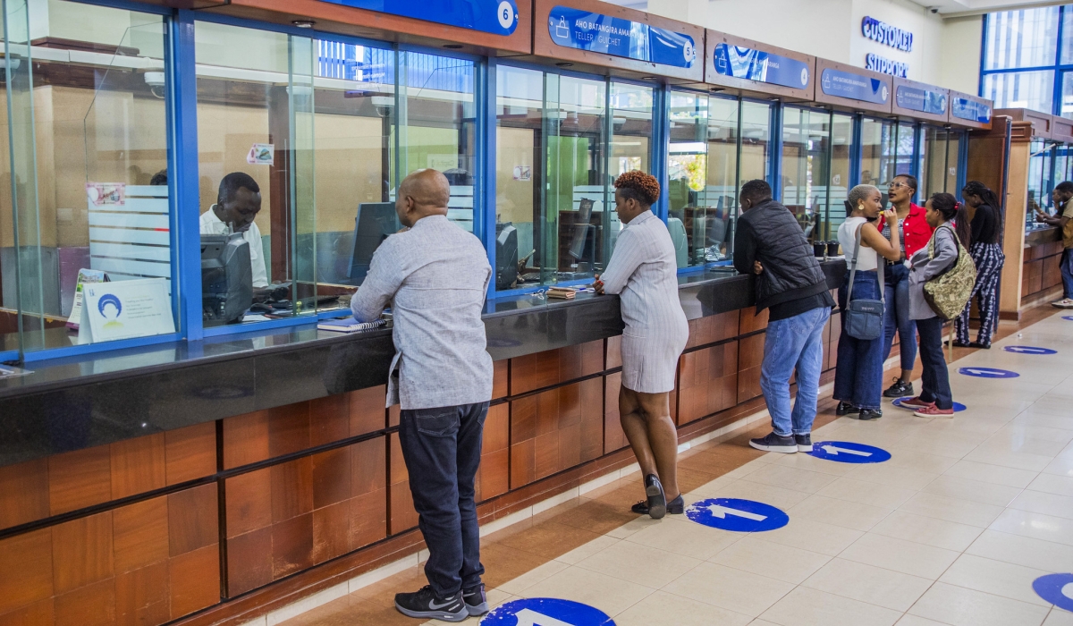 Bank tellers attend to the customers at Bank of Kigali main branch on October 10. Photo by Craish BAHIZI