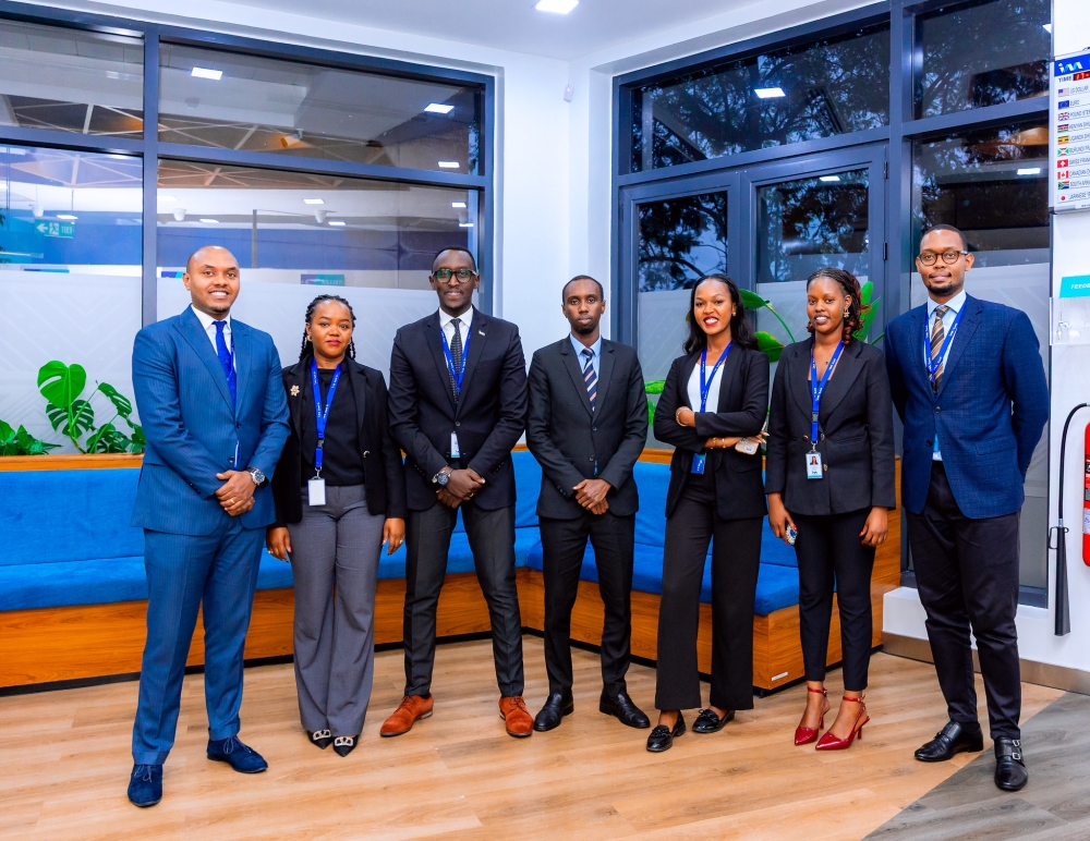 I&M Bank Rwanda Plc officials pose for a group photo during the opening ceremony on November 20. Photos by Craish Bahizi.