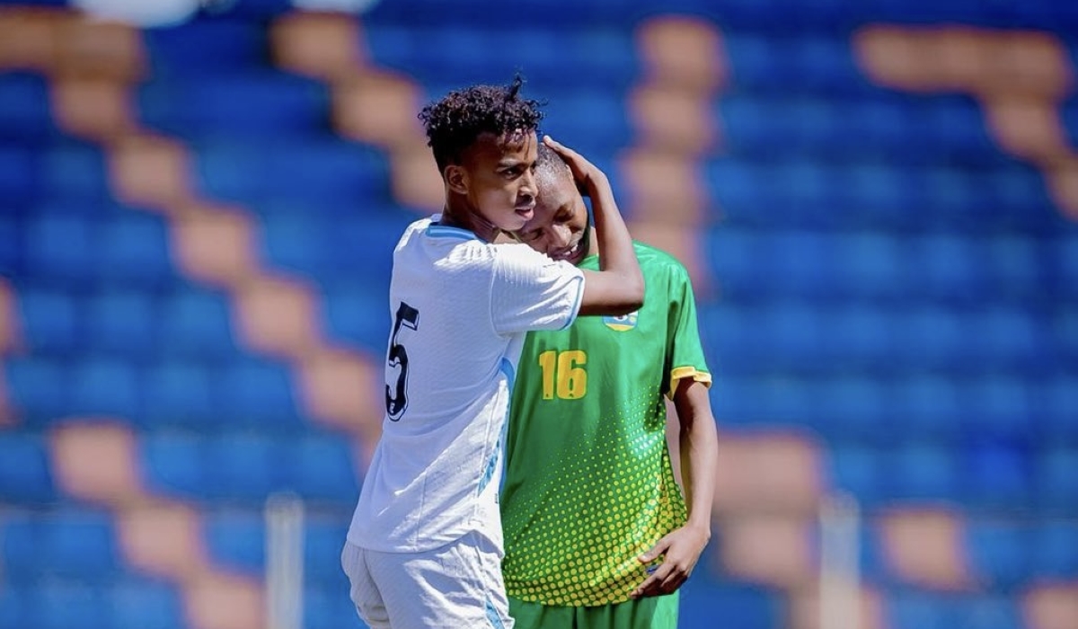 A Somalian player condoles Amavubi&#039;s Gustave Karibu at fulltime after Somalia beat Rwanda 2-1 in Monday&#039;s final FERWAFA U17 group stage match in Addis Ababa. Photo courtesy