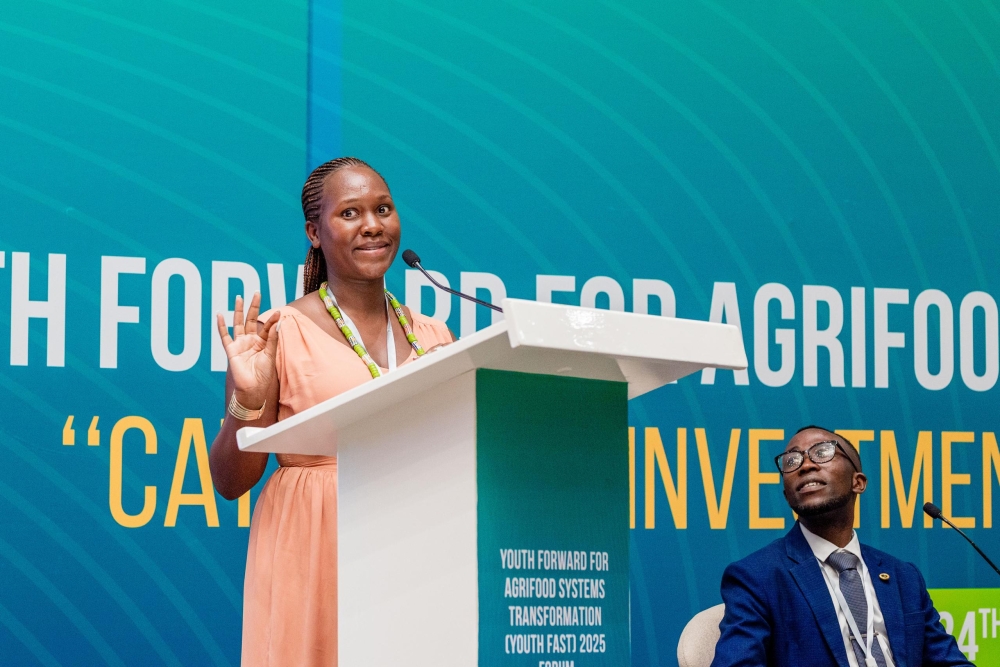 Mariette Mico shares her experience and how she ended up liking agriculture, as Janvier Nsanzimana (R) follow at the Youth Forward for Agrifood Systems Transformation (YOUTH FAST) Forum 2025, in Kigali, on November 24 (courtesy)