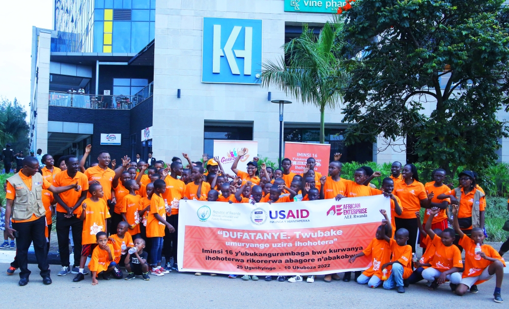 Participants pose for a group photo after completing the Anti-GBV Car-Free Day walk from BK Arena to the Kigali Convention Centre. Photo by Craish Bahizi