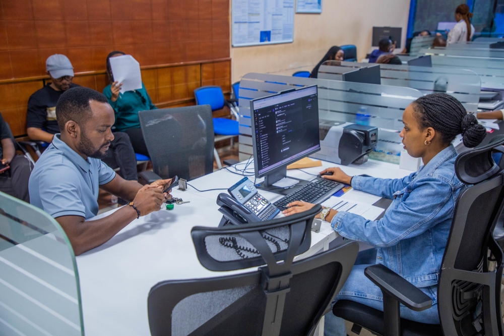 A client receives a service from a provider in Kigali on October 10. Photo by Craish Bahizi.