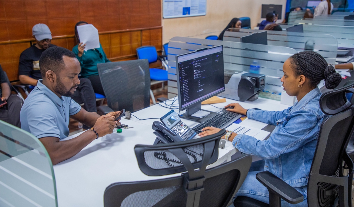 A client receives a service from a provider in Kigali on October 10. Photo by Craish Bahizi.
