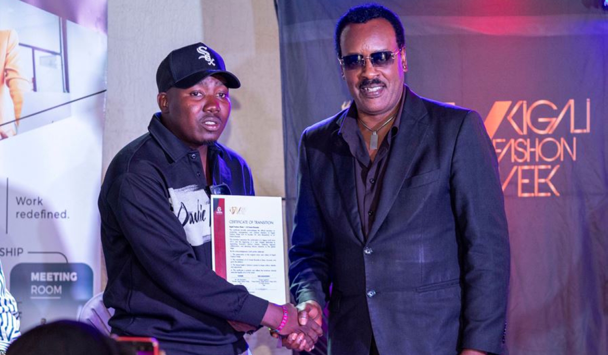 Bunyeshuli (R) officially handed over Kigali Fashion Week to LG Events Founder George Lugoloobi (L) after signing a seven-year management deal on Wednesday, November 26.Photo Courtesy