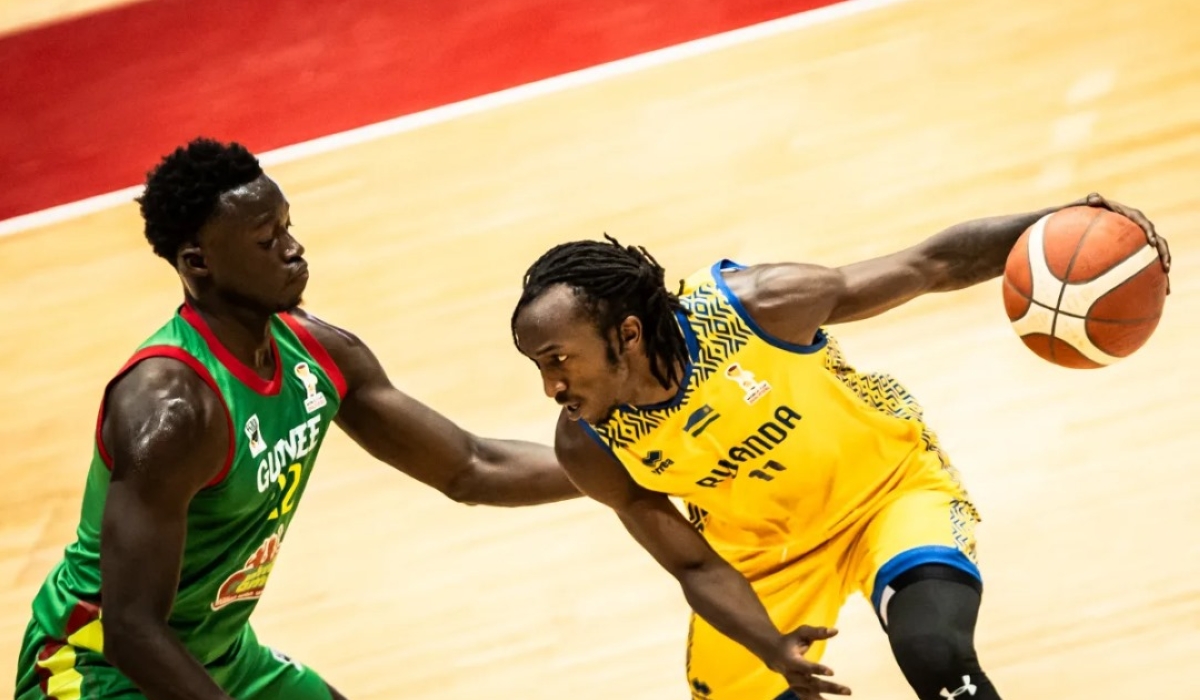 Rwanda star Jean Jacques Wilson Nshobozwabyosenumukiza (R) tries to dribble past Guinea&#039;s Ousmane Araphan Koba in Thursday&#039;s World Cup qualifiers opening match in Radès, Tunisia. Photo courtesy