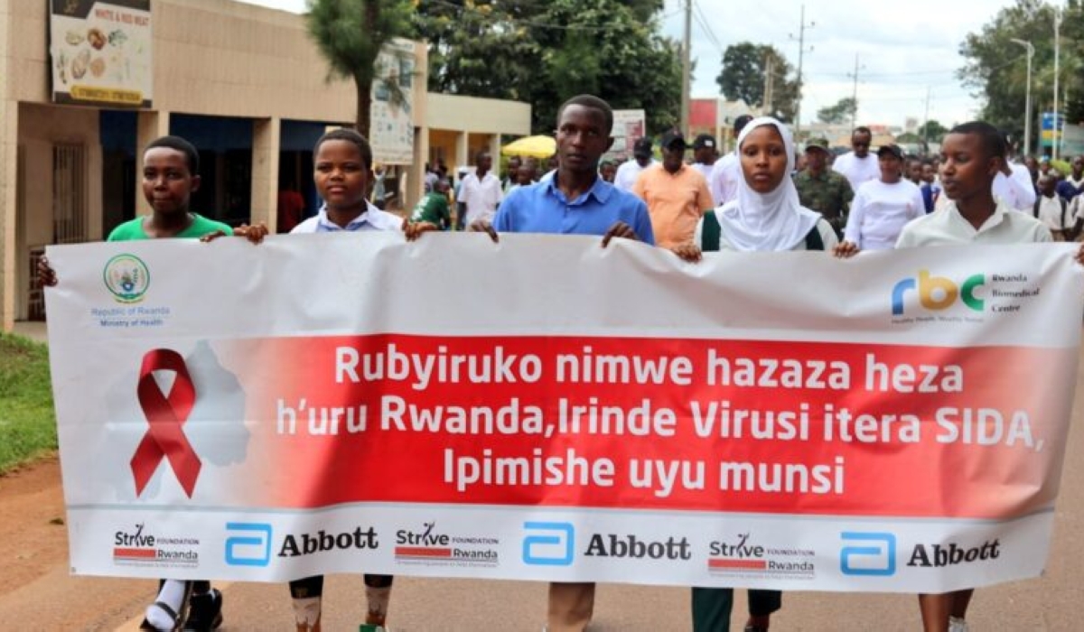 Students lead a march to raise awareness about HIV prevention, carrying a banner encouraging young people to get tested, in Rwamagana District, Eastern Province, on May 8. Courtesy.