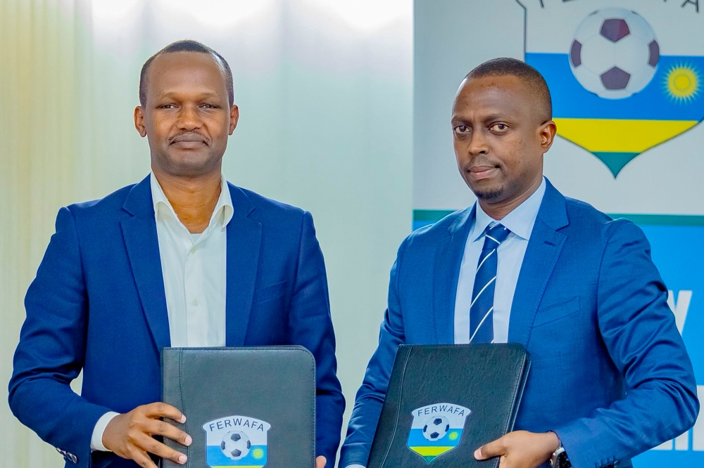 Mugabe (R) takes over from Richard Mugisha (L) who has been combining the SG role with his responsibilities as FERWAFA Vice President in charge of Technical Affairs. Courtesy Photo