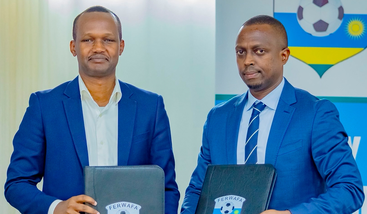 Mugabe (R) takes over from Richard Mugisha (L) who has been combining the SG role with his responsibilities as FERWAFA Vice President in charge of Technical Affairs. Courtesy Photo