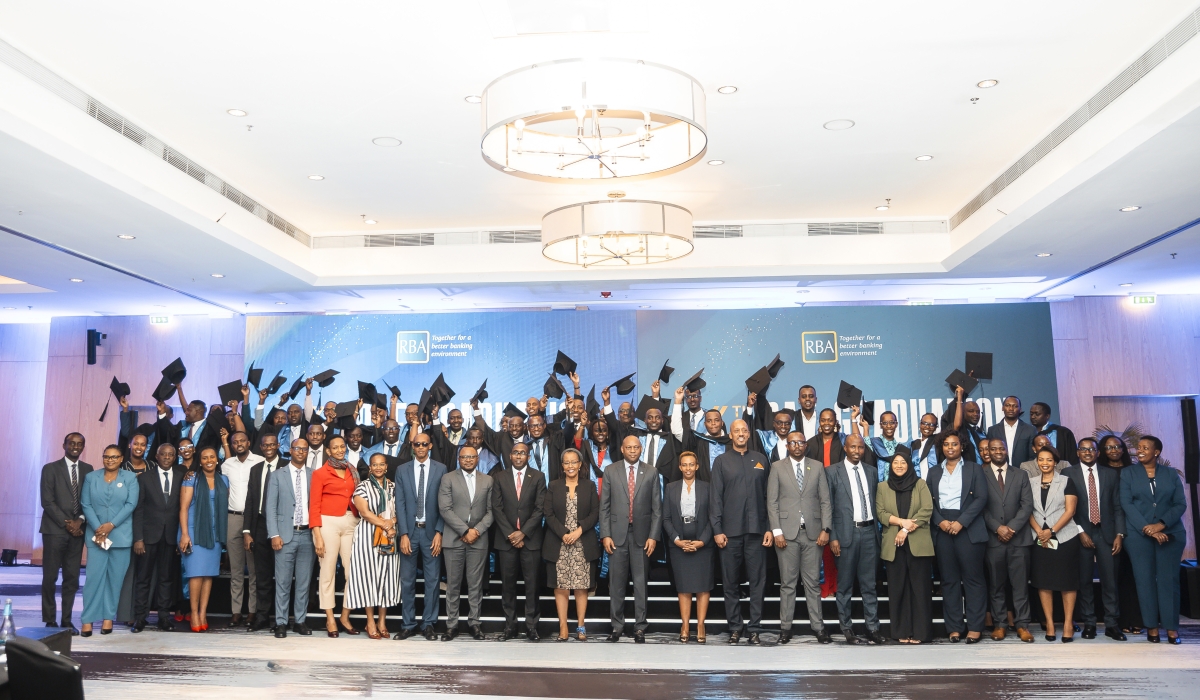Officials pose for a photo with graduates during the sixth graduation ceremony of the Rwanda Academy of Finance, held in Kigali on Monday, December 1. Courtesy 
