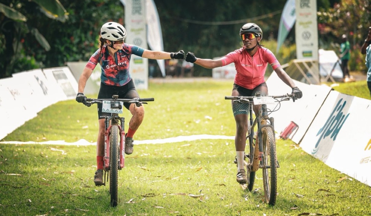 Rwanda&#039;s Ntakirutimana (R) and her Dutch counterpart Elodie Kuijper (L) celebrate after winning  second stage in women&#039;s duo of Rwanda Epic in Musanze on Tuesday.Photos courtesy 
